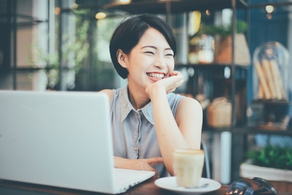 woman smiling on laptop