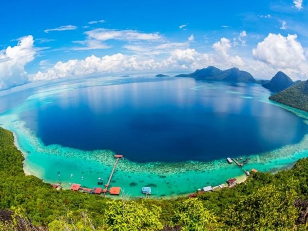 the deep blue waters of borneo under a sunny day