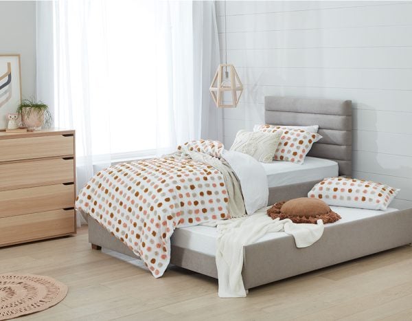 a trundle bed with a polka dot design