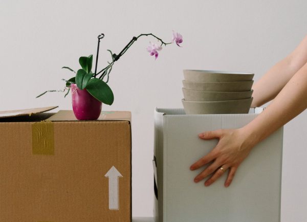 a woman organising the boxes for a move