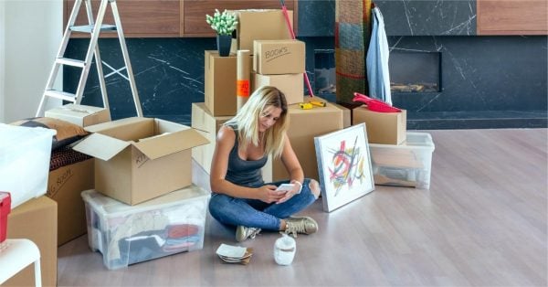 Woman Trying To Organise Boxes